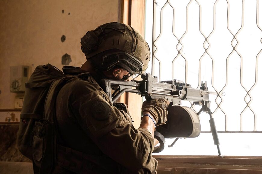 This picture released by the Israeli army shows a soldier taking part in military operations in an unspecified area of Gaza This picture released by the Israeli army shows a soldier taking part in military operations in an unspecified area of Gaza