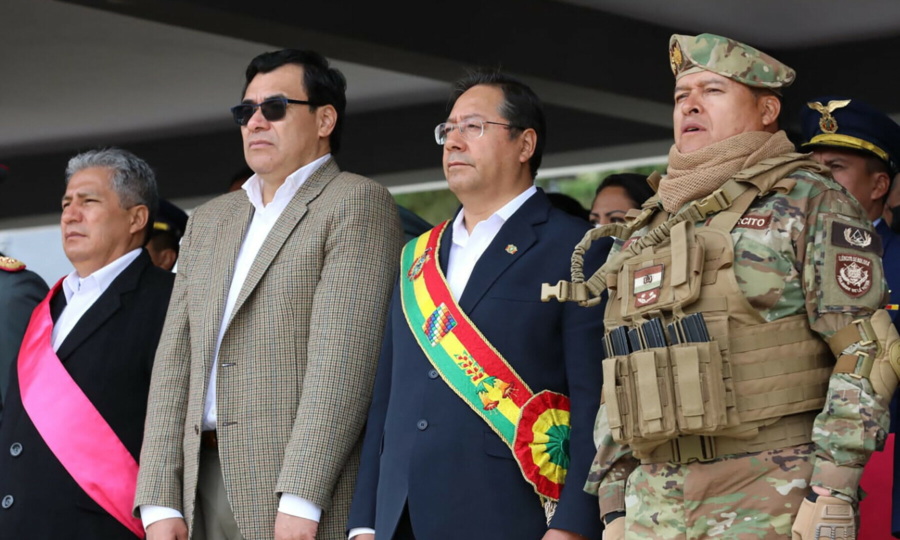 In this handout picture released by Bolivian Presidency, Bolivian President Luis Arce (2nd R) attends a military event next to Gen. Juan Jose Zuniga (R) in La Paz on April 18, 2024. — AFP